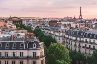 A view across rooftops of the Eiffel Tower in Paris, May 3, 2018.