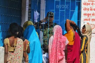 Women voters waiting at a polling booth in Bihar