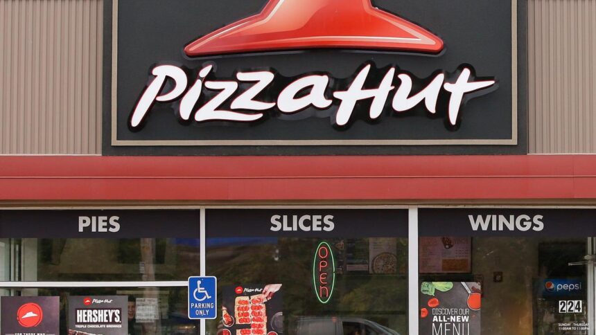 Pizza Hut's parent company Yum Brands says it is considering selling the chain