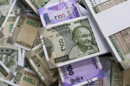 The rupee plunged by 50 paise to settle near an all-time low of Rs 90.84 against the US dollar.