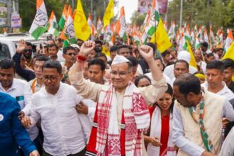 Assam Congress chief and the party's candidate from Jorhat constituency Gaurav Gogoi greeting supporters during his nomination rally ahead of the Assam Assembly elections. (PTI Photo)