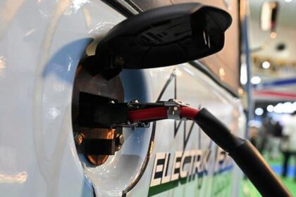 Why are auto companies opposing Delhi's revised electric vehicle policy?