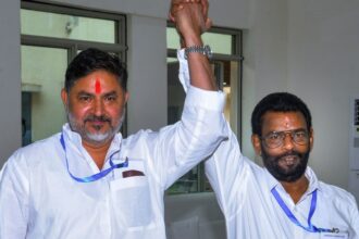 Congress candidate Pranav Jha, left, with Jharkhand Mukti Morcha (JMM) candidate Baidyanath Ram after they cast their votes during the Rajya Sabha elections, at Jharkhand Assembly. (PTI Photo)