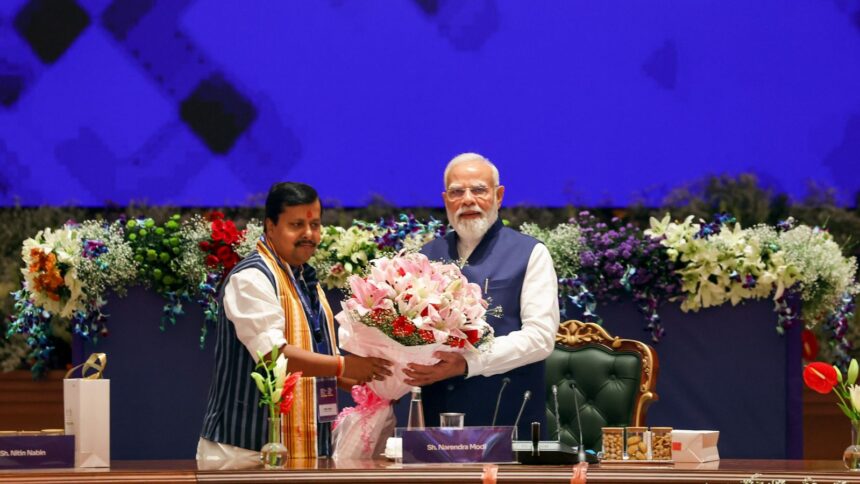 Prime Minister Narendra Modi is being felicitated by BJP National President Nitin Nabin as he chairs a high-level NDA Conclave at the Bharat Mandapam. (ANI Photo)