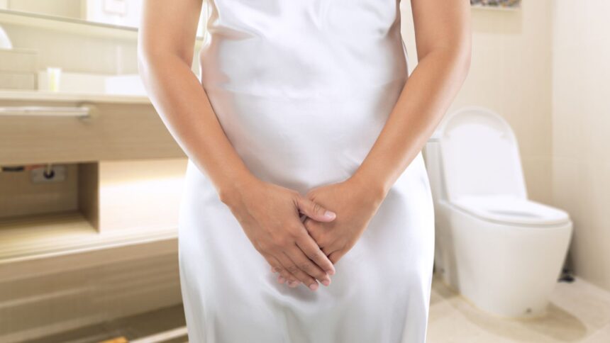 Woman experiencing urinary urgency during midlife