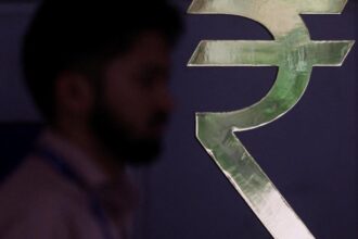The rupee gained 14 paise to close at Rs 95.21 against the US dollar.