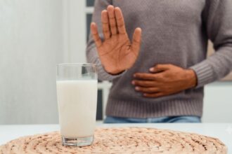 Why do people develop food intolerances such as towards milk and other products in adulthood?