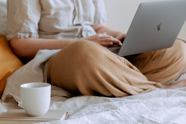Person working from bed with a laptop at home; what impact does it have on blood sugar