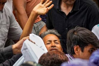 Activist Sonam Wangchuk, who has been on an indefinite hunger strike for 21 days, waves as he is shifted to a hospital from Jantar Mantar, in New Delhi. (PTI Photo)