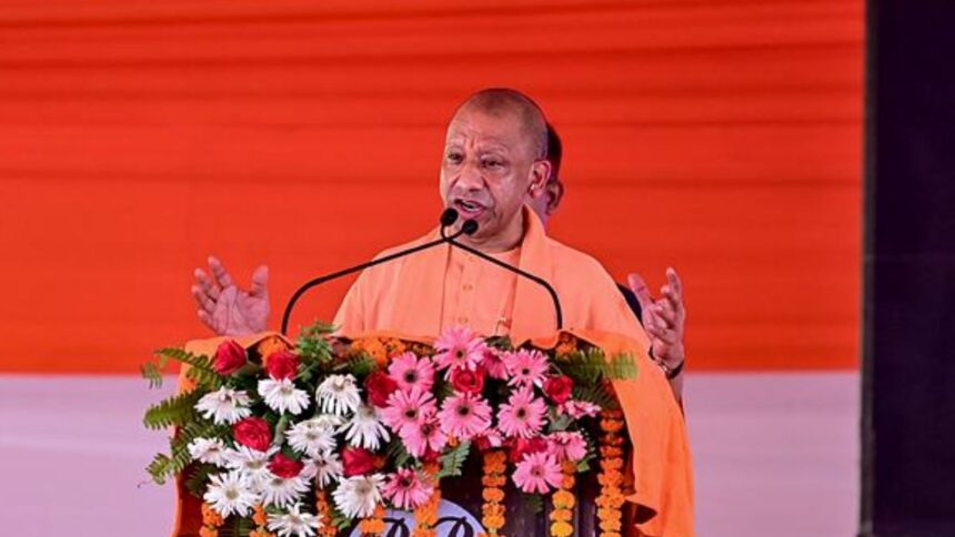 Uttar Pradesh Chief Minister Yogi Adityanath addresses a public rally, in Fatehpur, Uttar Pradesh. (PTI Photo)
